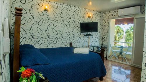 Postel nebo postele na pokoji v ubytování Hotel La Llave Del Mar