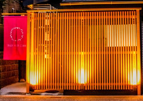 a yellow metal door with lights on it at USJ 2 stops, Umeda&Dotonbori 8mins, Ninja Style SV1 in Osaka