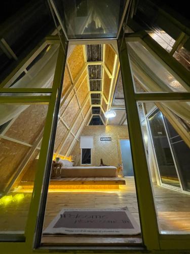 a view from the inside of a house with a window at Coffee and Resort in Ko Phayam