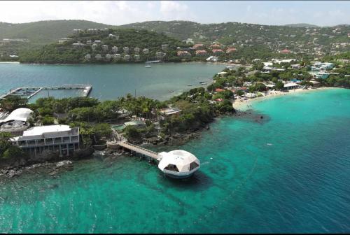 a boat is docked at a dock in the water at Island Daze - Amazing Views in East End