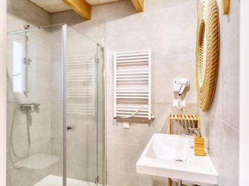 a bathroom with a glass shower and a sink at Luxury holiday homes, swimming pool, Sarbinowo in Sarbinowo