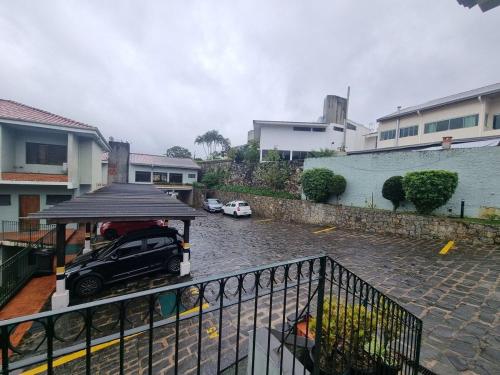 a car parked in a parking lot in the rain at Lindo loft decorado no centro c/ garagem in São Roque