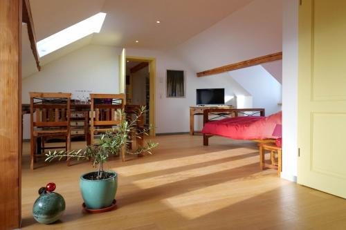 a living room with a bed and a dining room at Goldener Löwe in Bodman-Ludwigshafen