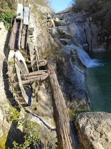 a set of stairs next to a river at Apartment Pod Lipom in Roč