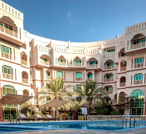 Bazén v ubytování Muscat Oasis Residences nebo v jeho okolí