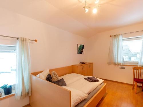 a bedroom with a bed in a room at Apartment in Niedernsill near Ski Slopes in Niedernsill