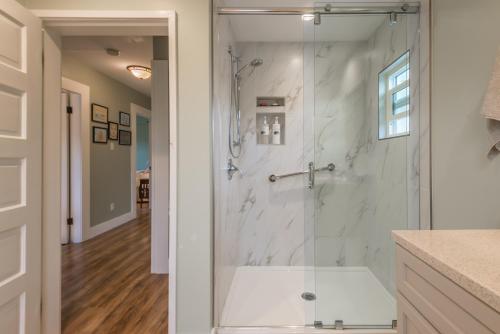 a bathroom with a shower with a glass door at Outdoor Lovers in Port Alberni