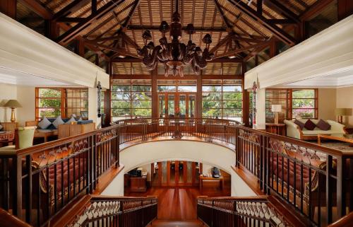 a large room with a wooden ceiling and a chandelier at Nusa Dua Beach Hotel & Spa, Bali in Nusa Dua