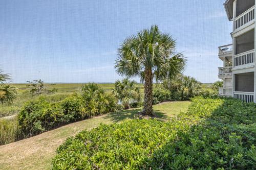 a palm tree in front of a building at Birds Eye View in Saint Simons Island