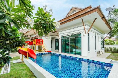 a villa with a swimming pool and a house at Villa Me&you4 in Ban Bo Fai (1)