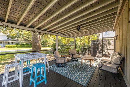 a patio with a table and chairs on a deck at Bella Vita in Saint Simons Island