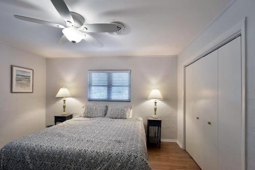 a bedroom with a bed and a ceiling fan at 1058 Sherman Avenue in Saint Simons Island
