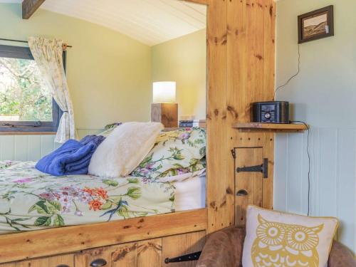 a bedroom with a wooden bunk bed with a window at 1 bed property in Beesands 86462 in Beesands