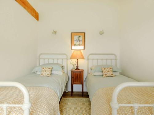 מיטה או מיטות בחדר ב-2 bed in Barnstaple 87749