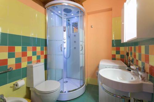 a bathroom with a shower and a toilet and a sink at hiresicily - Appartamento Eucaliptus in Avola