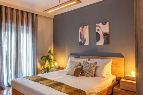 Ένα ή περισσότερα κρεβάτια σε δωμάτιο στο Alkea Thessaloniki