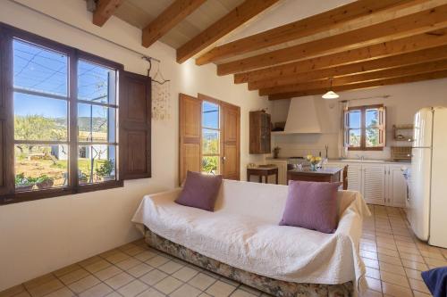 a room with a couch in a kitchen with windows at Finca Faustina Only Adults in Selva in Selva