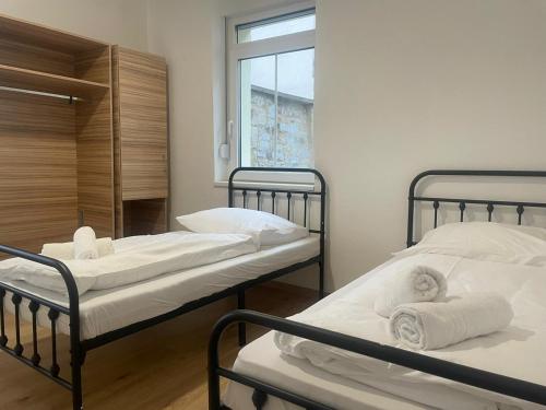 Ένα ή περισσότερα κρεβάτια σε δωμάτιο στο Timeless: 4 Zimmer Apartment Ludwigsburg