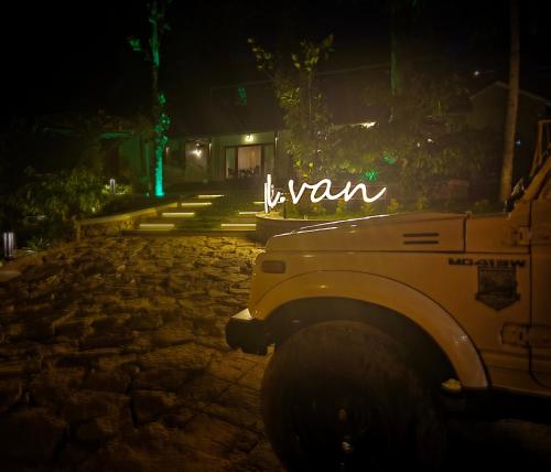 a jeep parked in front of a building at night at SylVan Resort in Wayanad