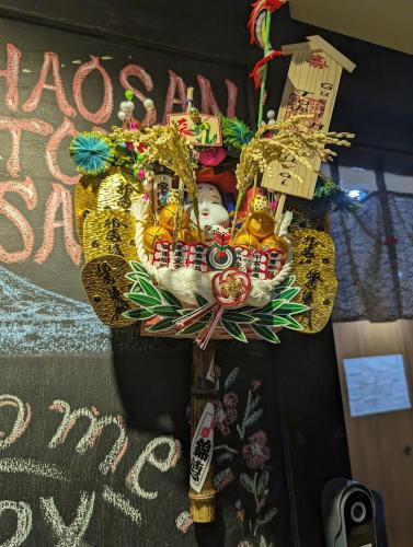 a door with a christmas wreath on the door at Guest House Tokyo Samurai in Tokyo