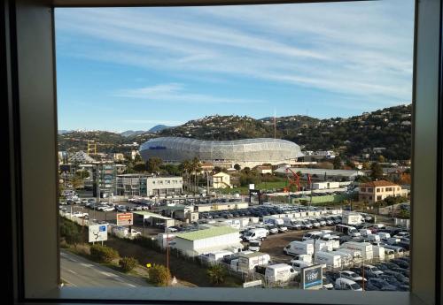 a view of a parking lot with a soccer stadium at B&B HOTEL Nice Stade Riviera in Nice