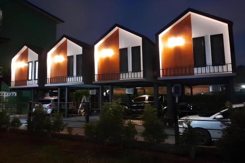 a building with three balconies on top of it at N&N HOUSE Laem Hin in Ban Laem Hin