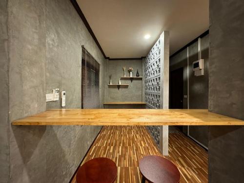 a kitchen with a wooden counter in a room at BAAN CHAINARONG in Ko Lanta