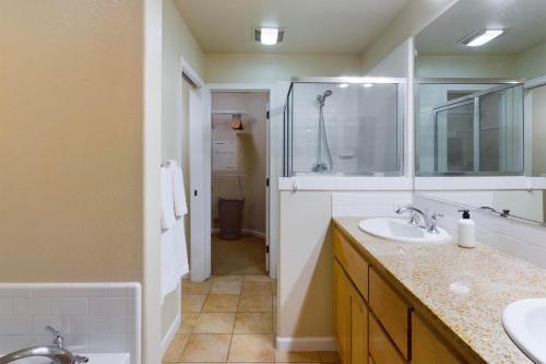 a bathroom with two sinks and a shower at San Jose 3br w pool spa patio parking SFO-1537 in San Jose