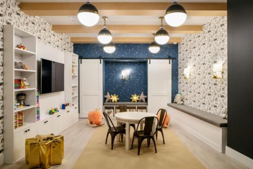 a childrens playroom with a table and chairs at FiDi 1br w doorman gym nr wall street NYC-1342 in New York