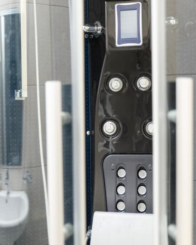 a close up of a cell phone in a bathroom at HOTEL ALBES in Prizren