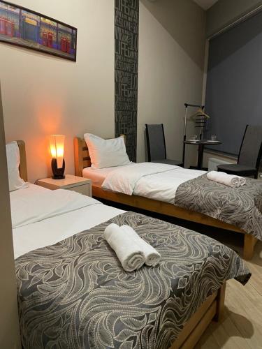 Postel nebo postele na pokoji v ubytování New Hotel