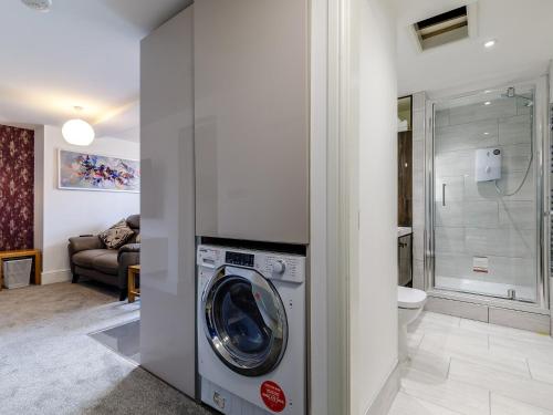 a bathroom with a washing machine in a room at 1 Bed in Chester 78586 in Chester