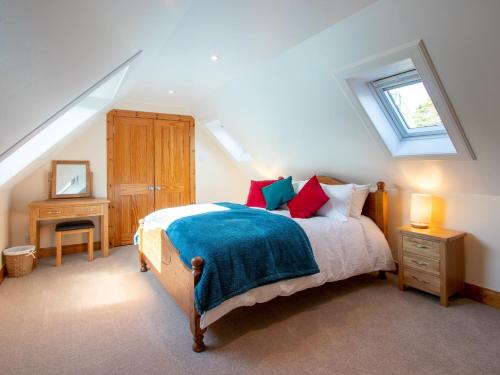 a bedroom with a bed and a skylight at 3 bed property in Blair Atholl 78841 in Trinafour