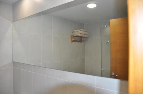 a bathroom with a shower and a mirror at Great apartment penthouse 2 bedrooms Tejita Beach in El Médano