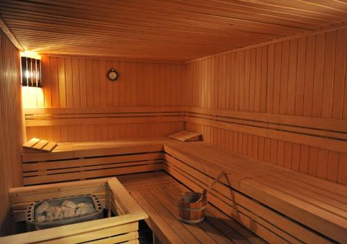 a wooden sauna with two benches in it at Avala Resort & Villas in Budva