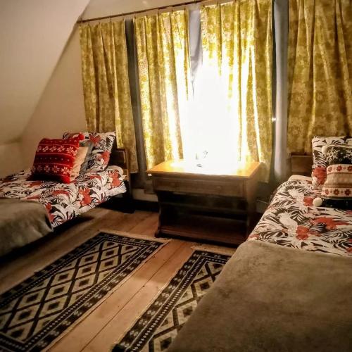 Postel nebo postele na pokoji v ubytování Ranczo Ignacowo