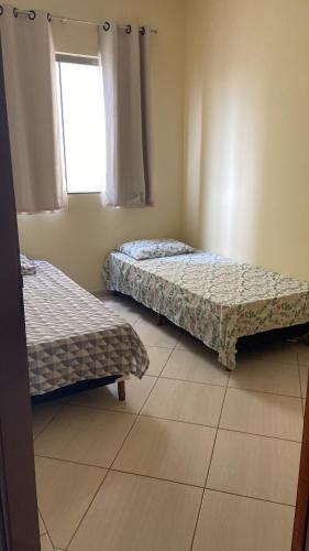 Postel nebo postele na pokoji v ubytování Apartamento Centro Alfenas