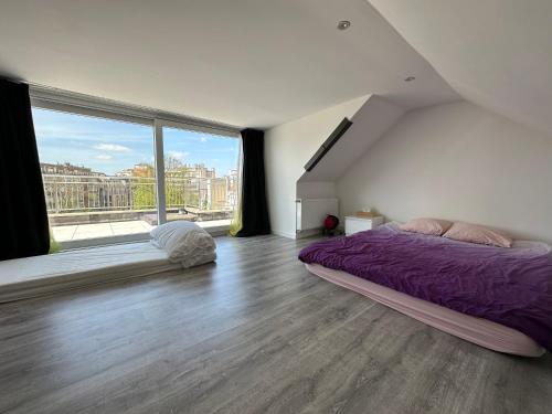 Postel nebo postele na pokoji v ubytování Dreamland Apartments EU, Brussels