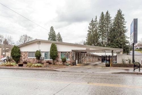 a gas station on the side of a street at Rodeway Inn La Grande - Island City in La Grande