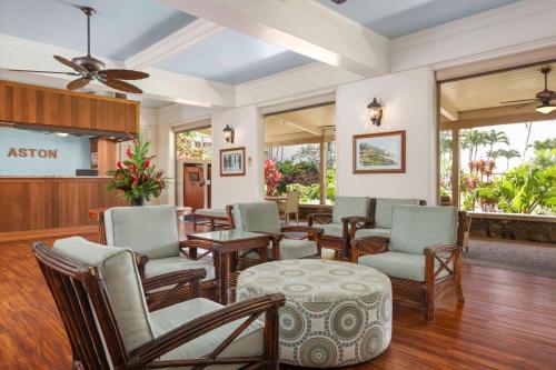 a waiting room at a hospital with chairs and tables at Aston Islander On The Beach in Kapaa