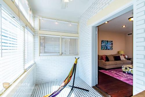 a room with a door leading to a living room at Breakfast Club - U of Tampa Flat in N Hyde Park in Tampa