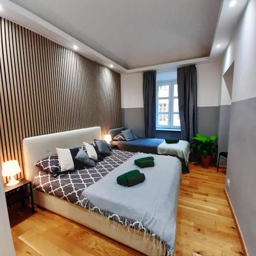 a bedroom with a large bed and a large window at Casa Bracco in Turin