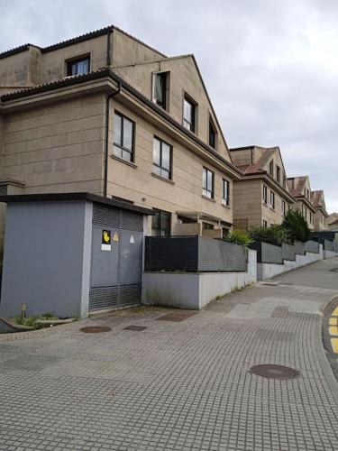 a building on a street in front of a building at RESIDENCIAL A MAMOA in Carreira