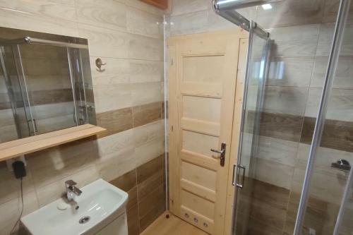 a bathroom with a sink and a shower at Tiny Treperka in Semily