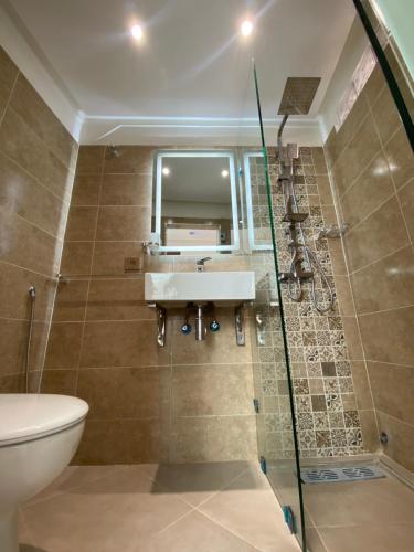 a bathroom with a sink and a shower at Riad Jbara 2 in Rabat