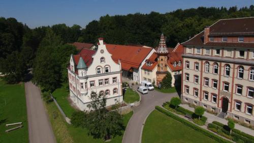 an aerial view of a large house and buildings at Kloster Bonlanden in Berkheim