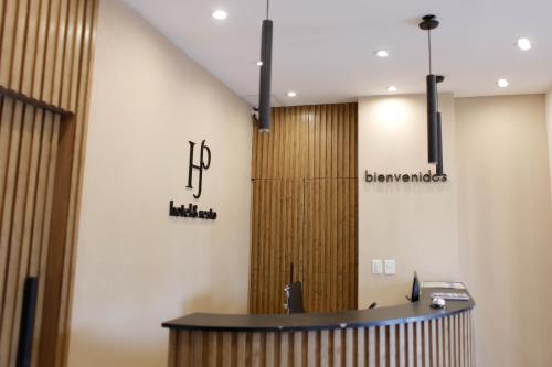 a lobby with a reception desk in a building at San Pedro Hotel & Restó in San Pedro