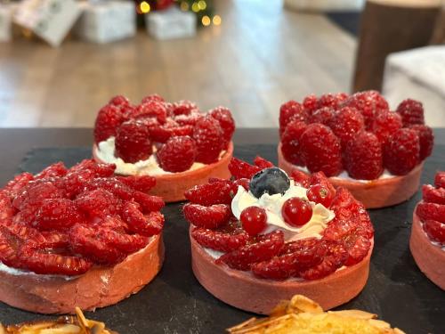 a group of four desserts with strawberries and berries at Best Western Plus Thionville Centre in Thionville