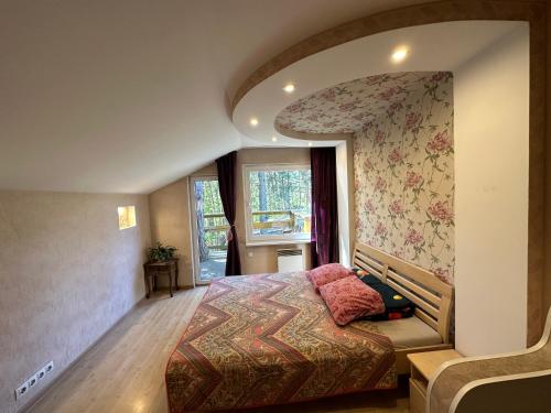 a bedroom with a large bed in a room at House By The Sea With Hot Tub in Riga