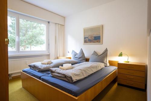 Postel nebo postele na pokoji v ubytování Brentschpark Wohnung 72